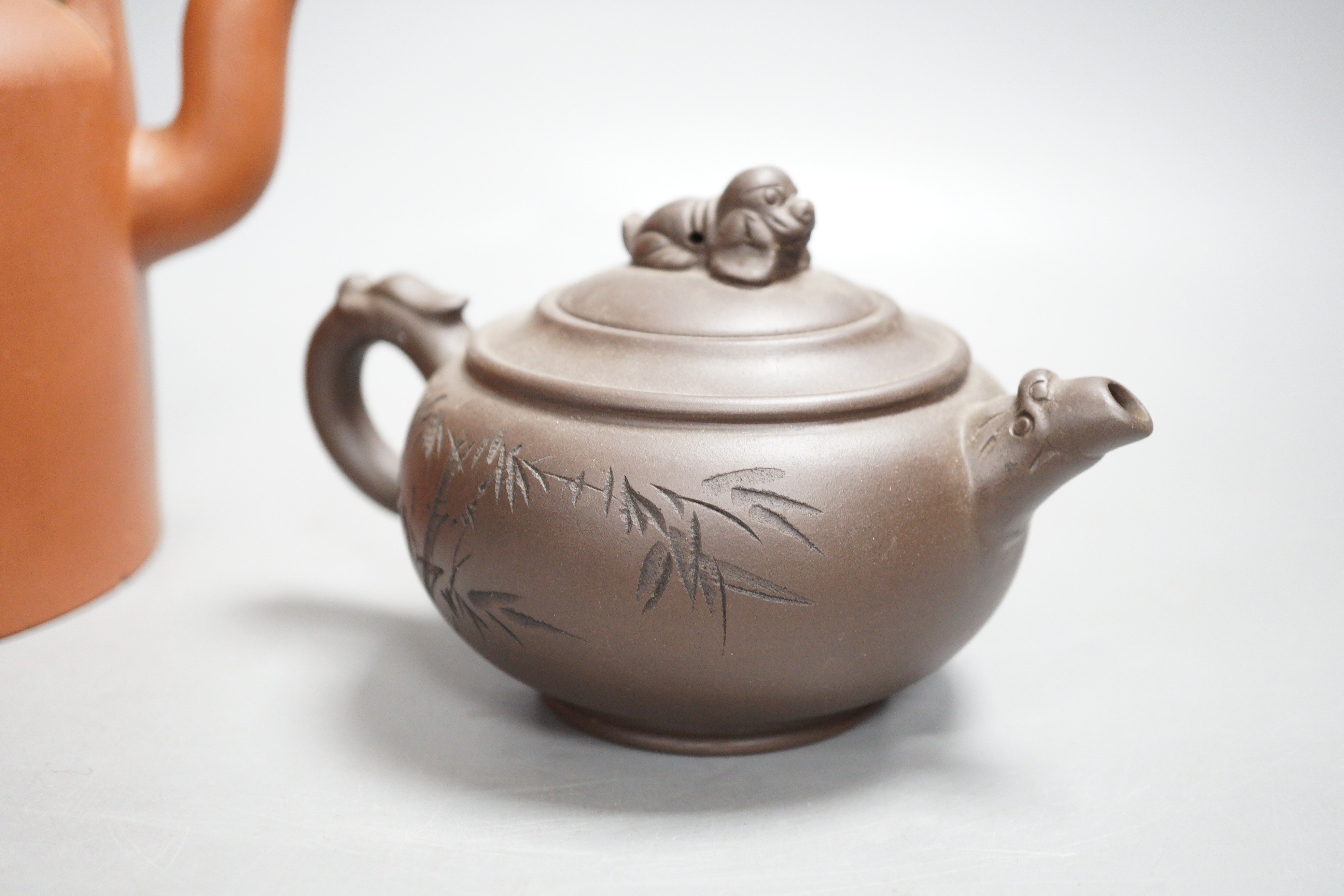 Two Chinese Yixing teapots and two similar teabowls. Tallest 14cm